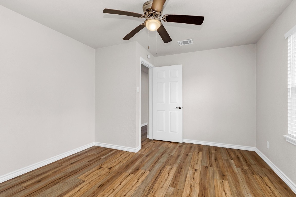 338 South Walker Road Conroe, TX 77306 - Photo 10 of 25 a view of empty room with wooden floor