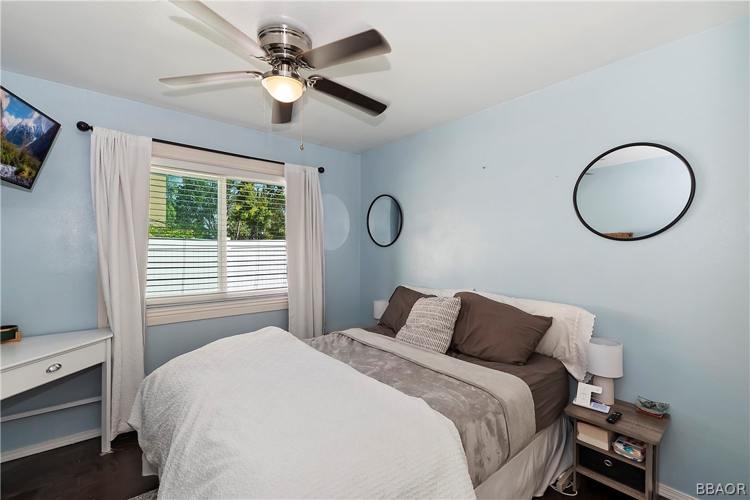 2201 Wagon Train Street Corona, CA 92878 - Photo 12 of 24 a bedroom with a bed and a chandelier