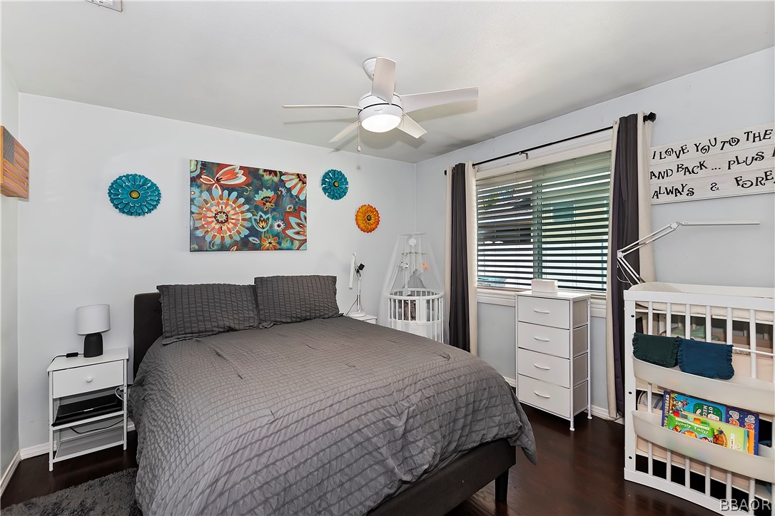 2201 Wagon Train Street Corona, CA 92878 - Photo 13 of 24 a bedroom with a bed and a book shelf