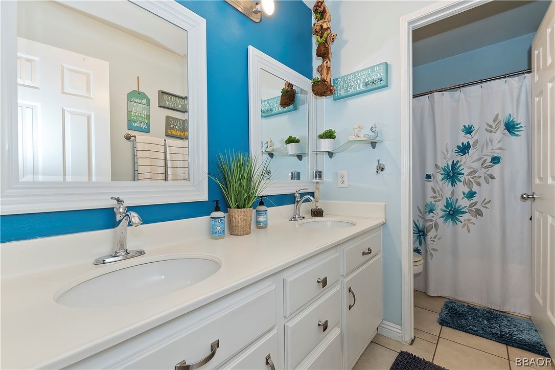 2201 Wagon Train Street Corona, CA 92878 - Photo 15 of 24 a bathroom with a sink and a mirror