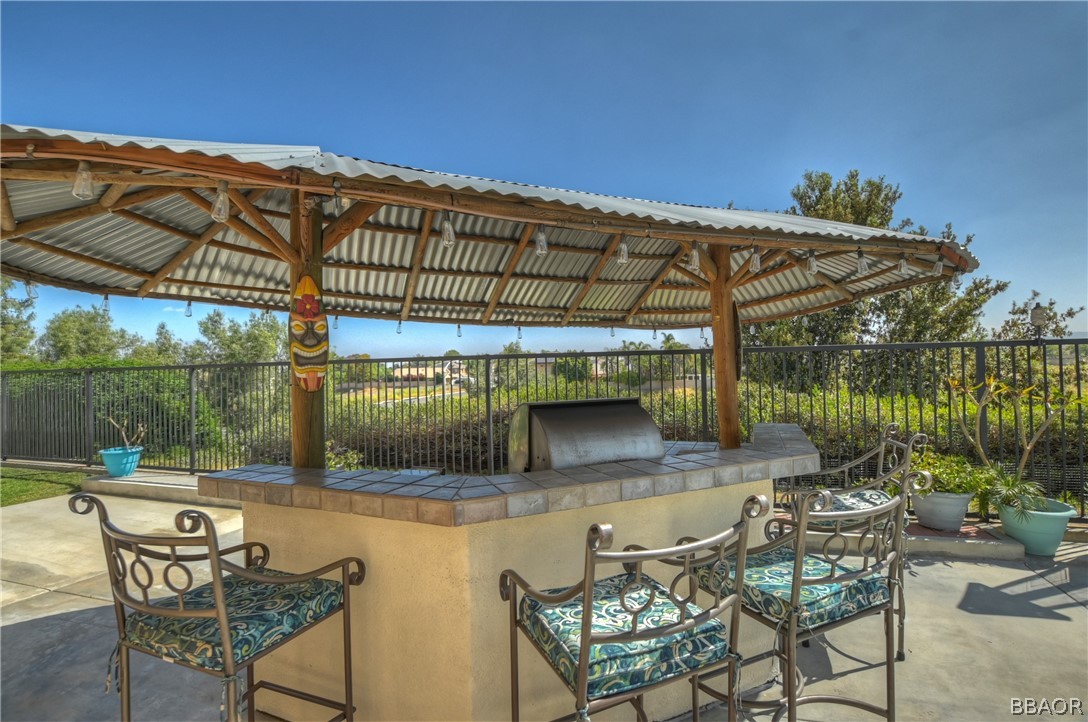 2201 Wagon Train Street Corona, CA 92878 - Photo 19 of 24 a patio with glass top table and chairs