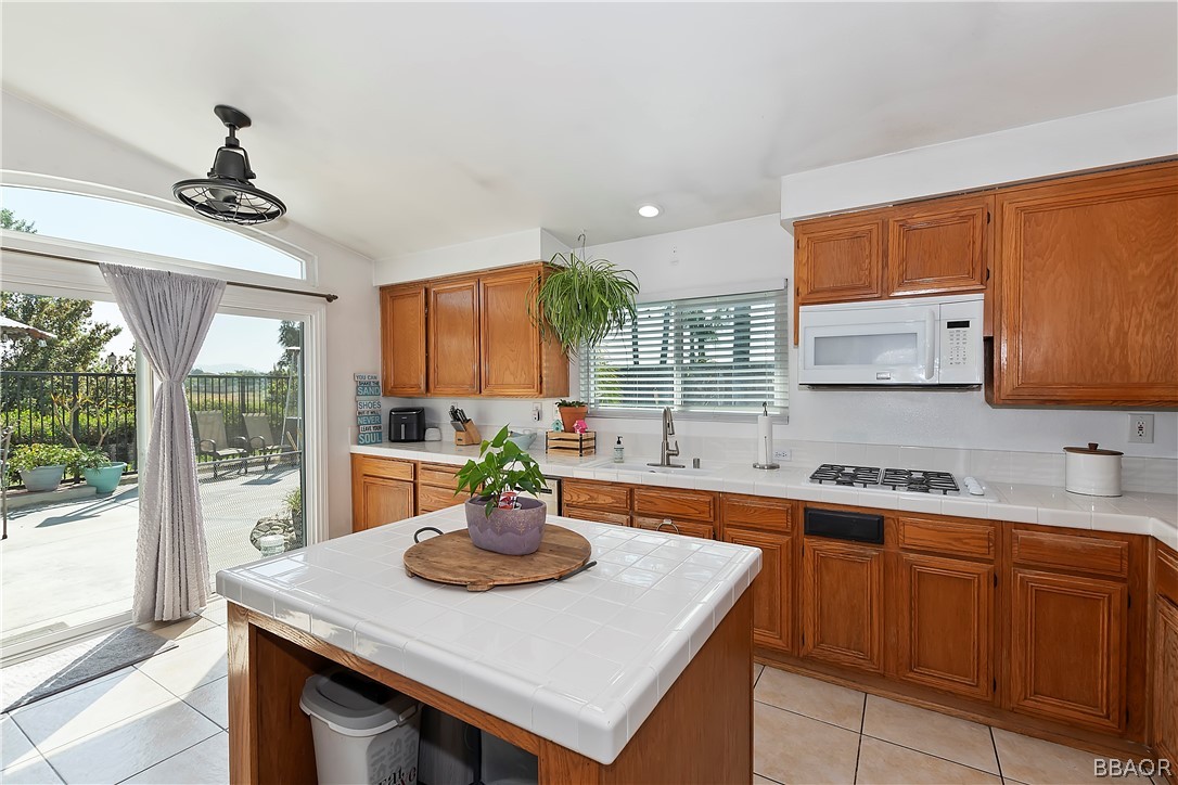 2201 Wagon Train Street Corona, CA 92878 - Photo 6 of 24 a kitchen with a sink a counter space cabinets and appliances