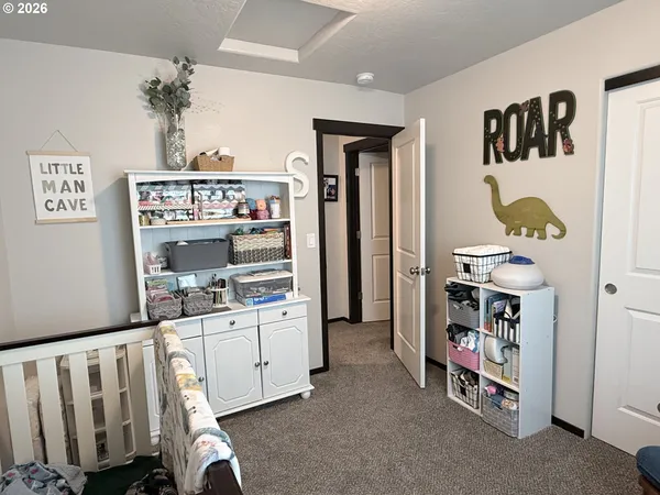 a room with furniture and white walls