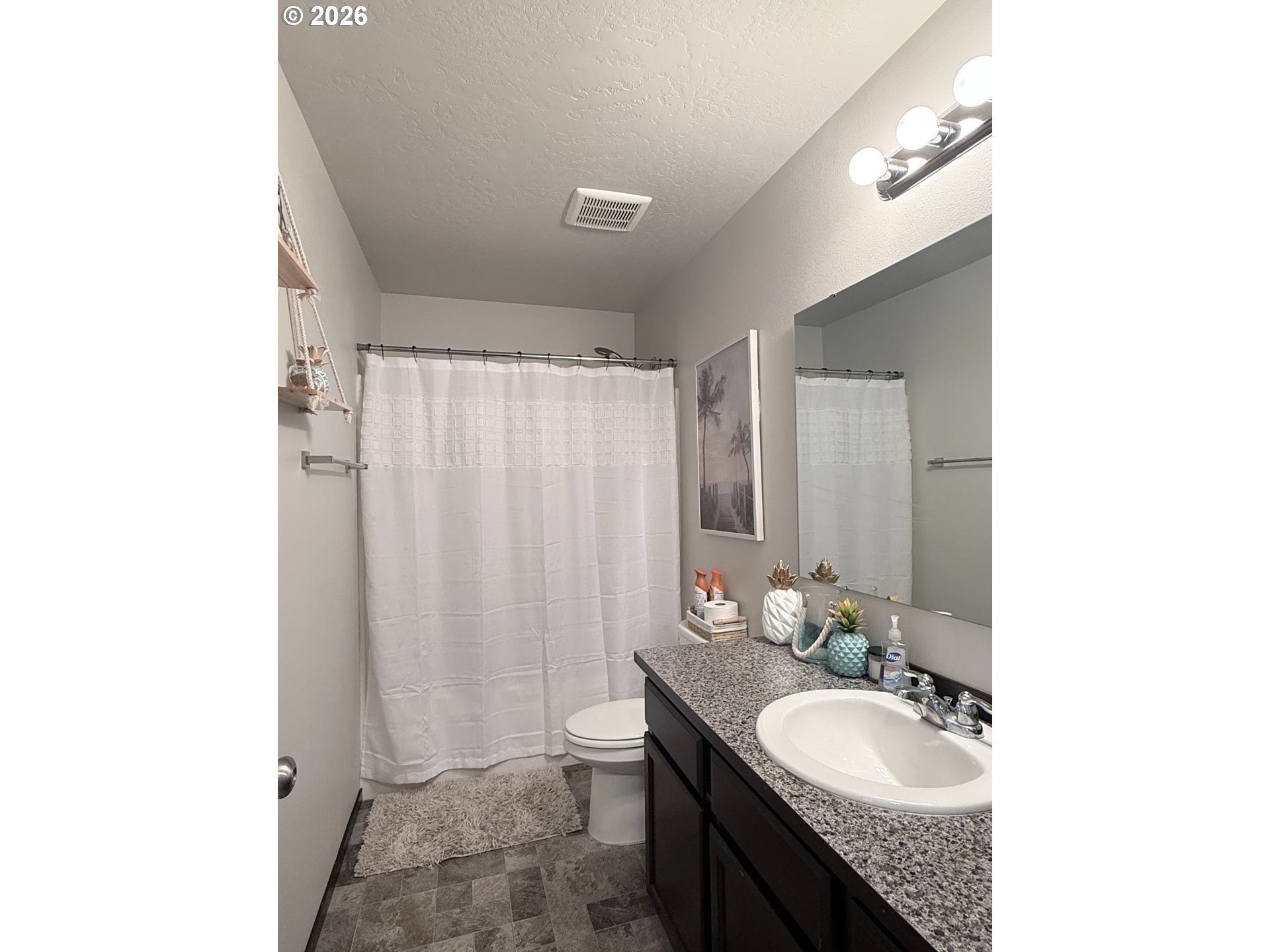 472 Cardinal Place Umatilla, OR 97882 - Photo 14 of 28 a bathroom with a granite countertop sink a toilet and a mirror