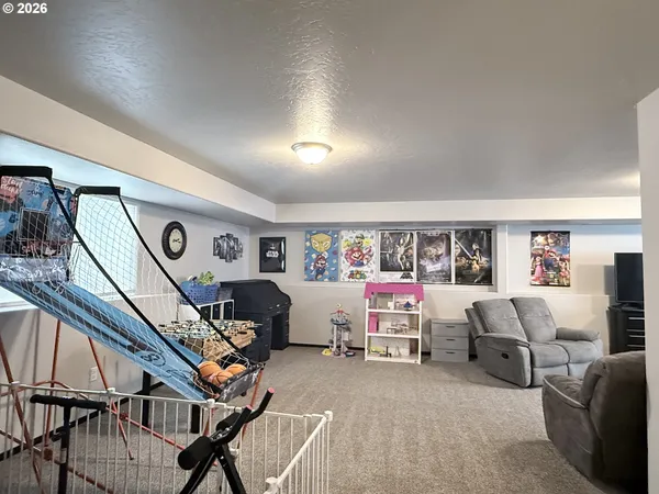 a bedroom with furniture and a wooden floor