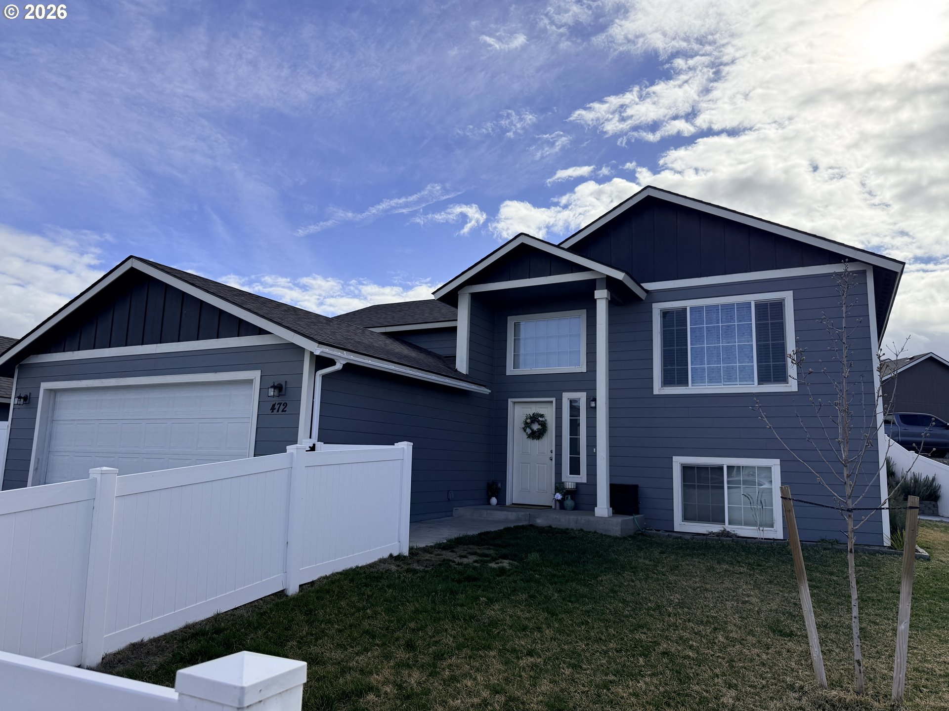 472 Cardinal Place Umatilla, OR 97882 - Photo 2 of 28 a front view of a house with a yard