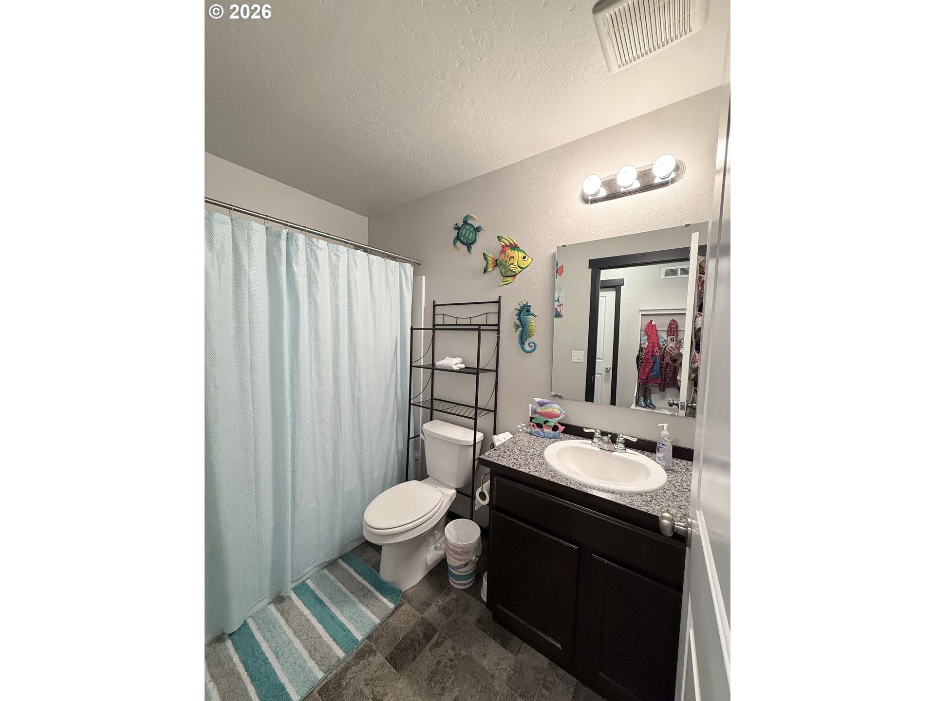 472 Cardinal Place Umatilla, OR 97882 - Photo 23 of 28 a bathroom with a sink and a mirror
