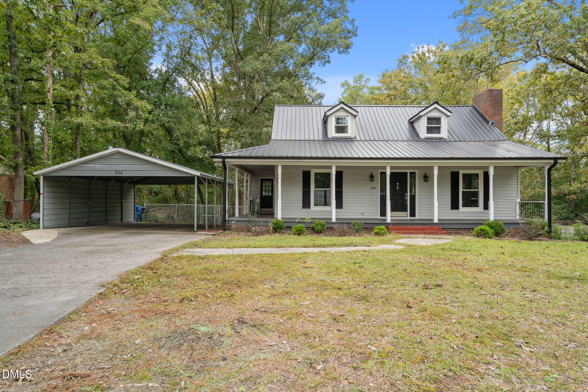 804 West Scotsdale Road Laurinburg, NC 28352 - Photo 1 of 41 a front view of a house with a garden