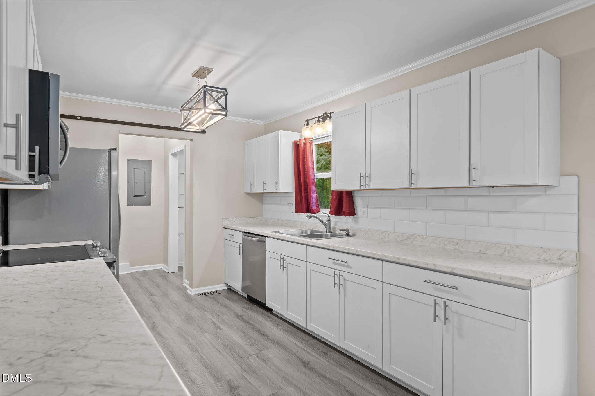 804 West Scotsdale Road Laurinburg, NC 28352 - Photo 12 of 41 a kitchen with a sink dishwasher and white cabinets