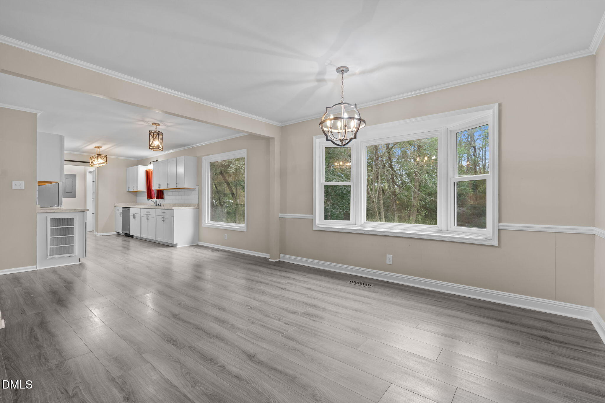 804 West Scotsdale Road Laurinburg, NC 28352 - Photo 12 of 46 a view of an empty room with wooden floor and a window