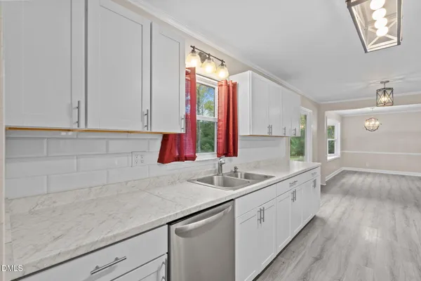 a kitchen with a sink and a window