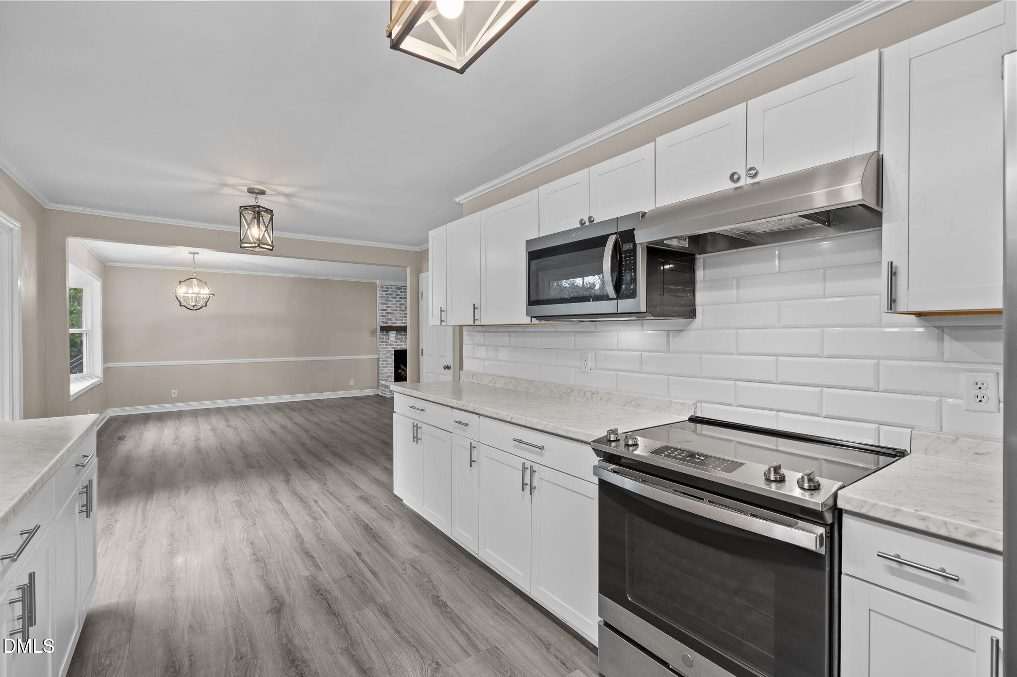 804 West Scotsdale Road Laurinburg, NC 28352 - Photo 15 of 41 a kitchen with granite countertop a stove and a sink