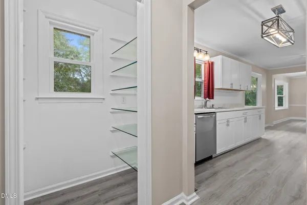 a view of cabinets with wooden floor windows and a window