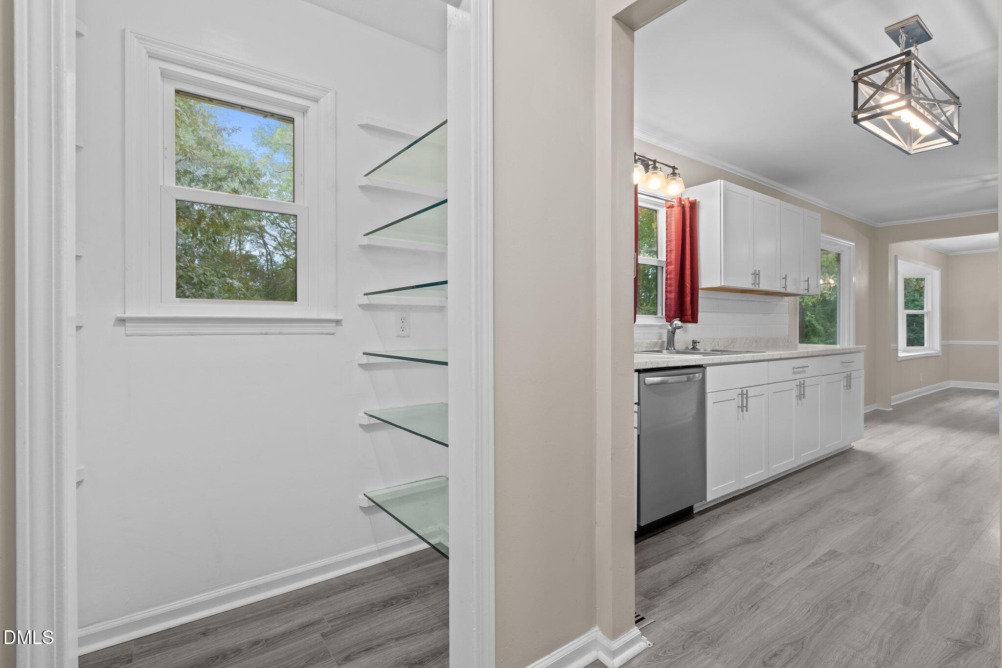804 West Scotsdale Road Laurinburg, NC 28352 - Photo 17 of 41 a view of cabinets with wooden floor windows and a window