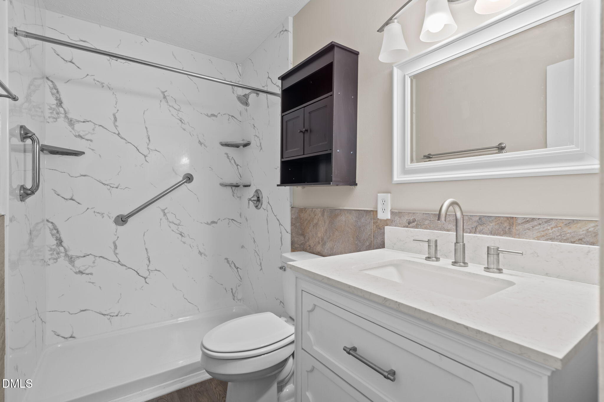 804 West Scotsdale Road Laurinburg, NC 28352 - Photo 18 of 41 a bathroom with a sink vanity mirror and toilet