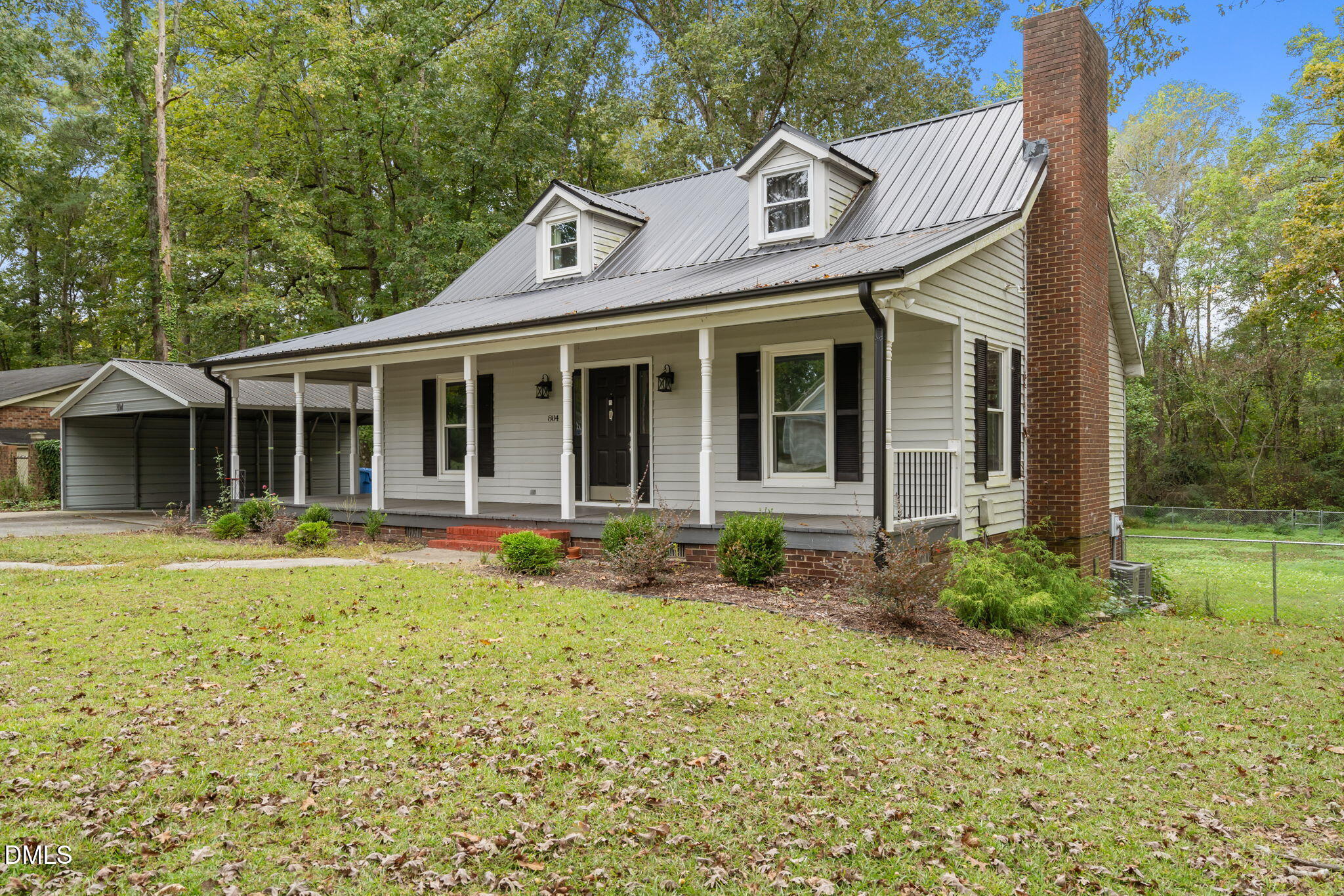 804 West Scotsdale Road Laurinburg, NC 28352 - Photo 2 of 41 a view of a house with backyard and garden