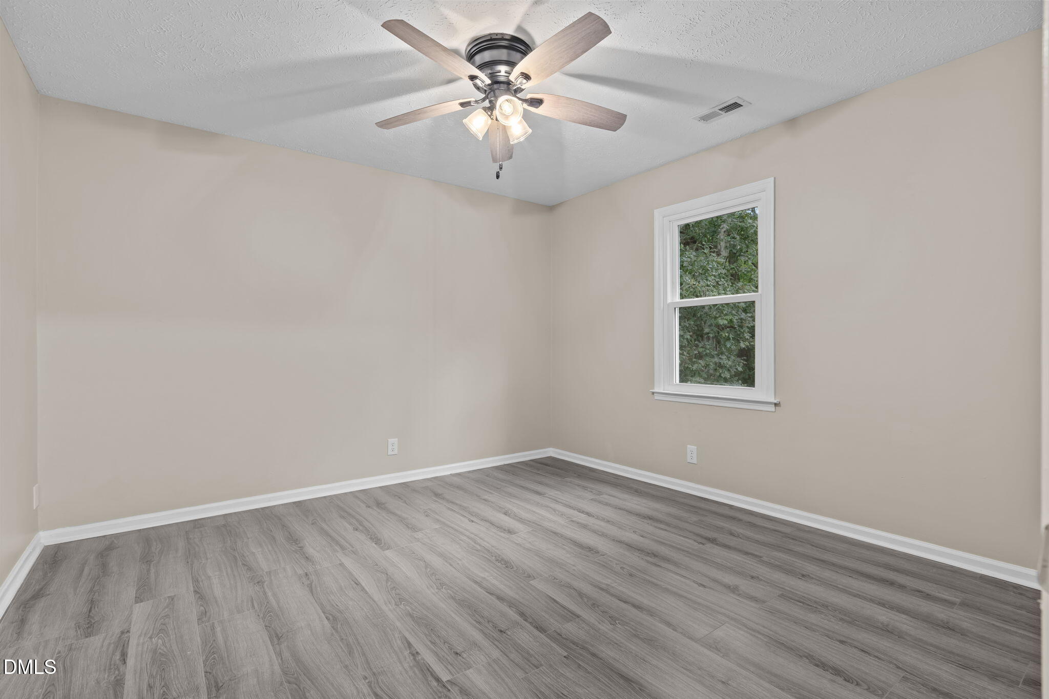 804 West Scotsdale Road Laurinburg, NC 28352 - Photo 25 of 41 wooden floor in an empty room with a window