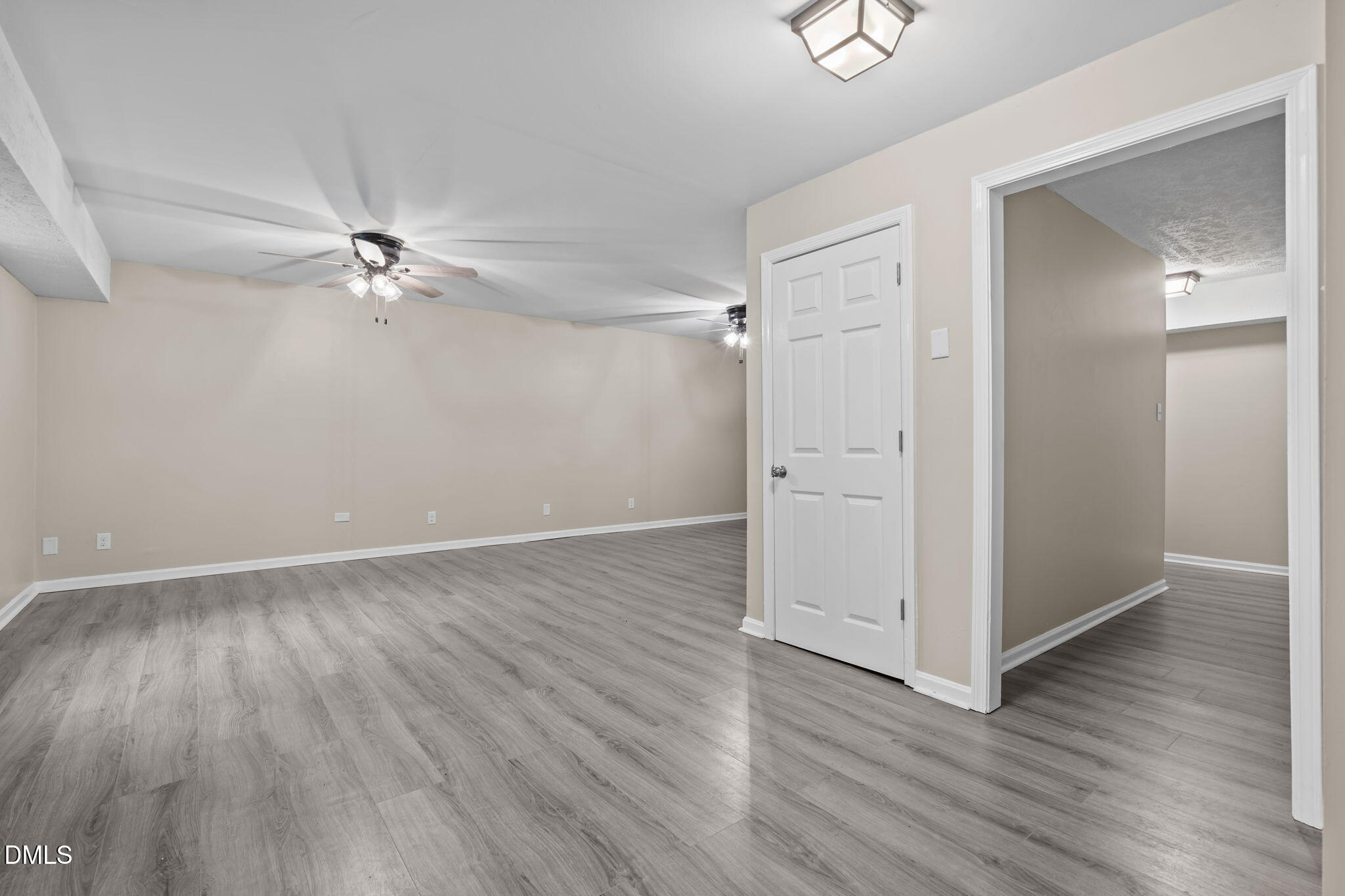 804 West Scotsdale Road Laurinburg, NC 28352 - Photo 31 of 46 an empty room with wooden floor and fan