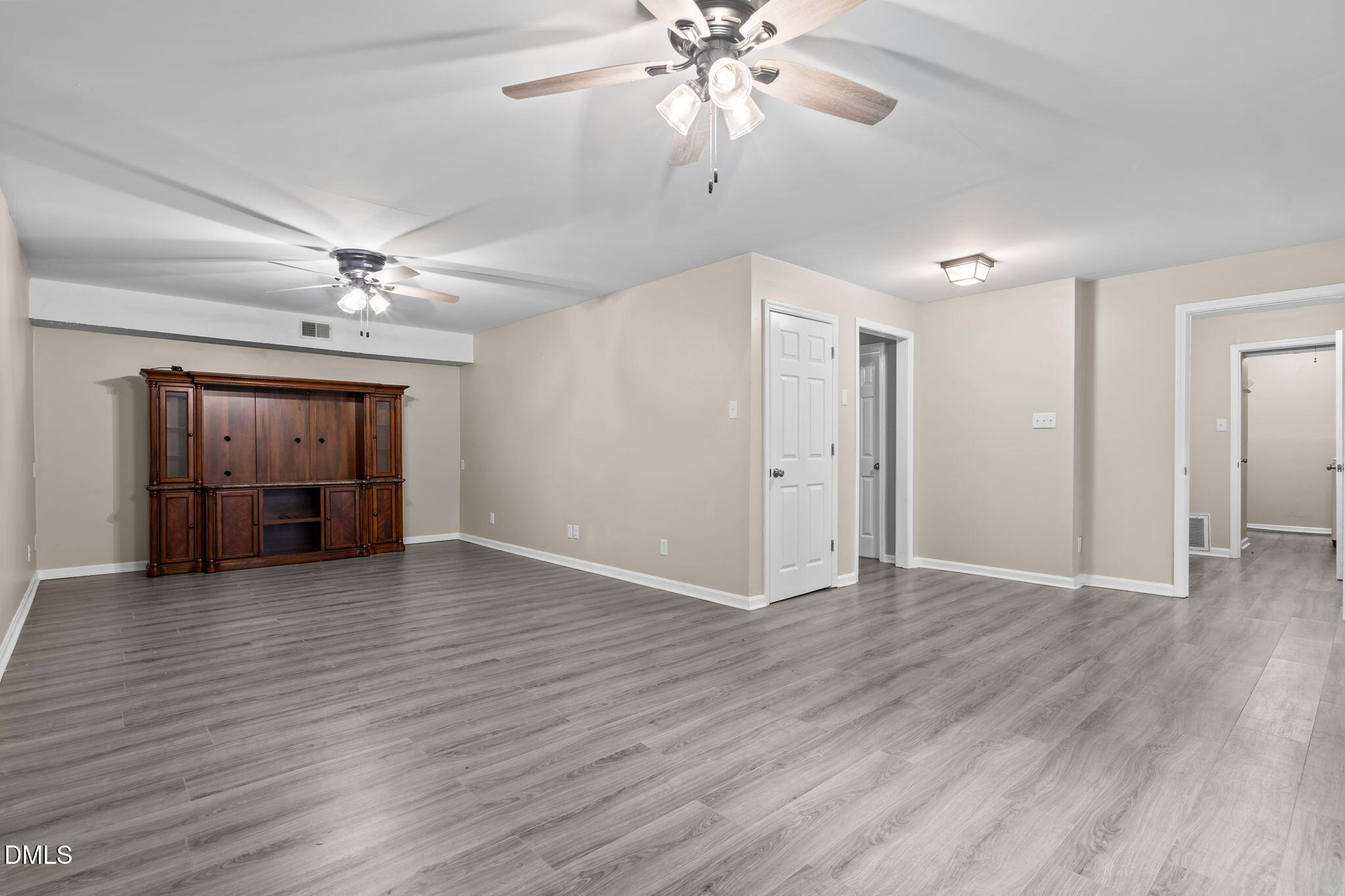 804 West Scotsdale Road Laurinburg, NC 28352 - Photo 32 of 46 a view of an empty room with wooden floor