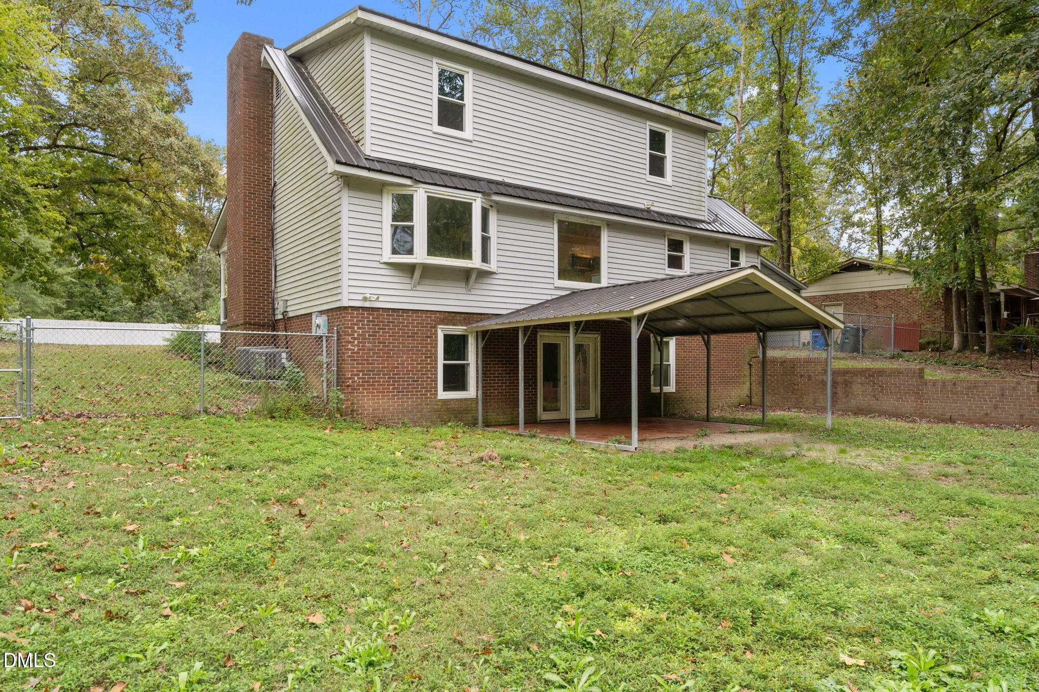 804 West Scotsdale Road Laurinburg, NC 28352 - Photo 34 of 41 a view of a house with yard and a tree