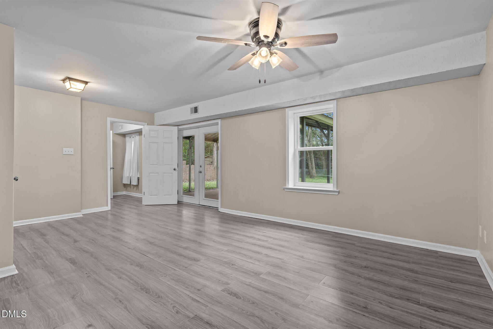 804 West Scotsdale Road Laurinburg, NC 28352 - Photo 34 of 46 a view of an empty room with wooden floor and a window