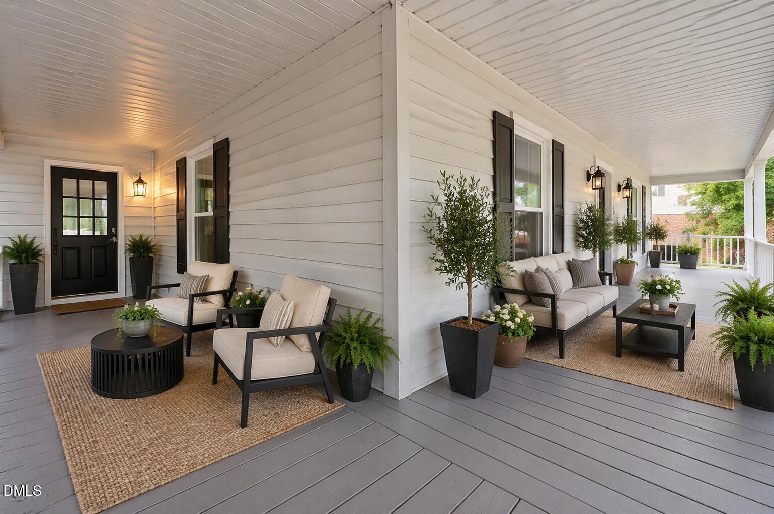 804 West Scotsdale Road Laurinburg, NC 28352 - Photo 4 of 46 a view of a patio with couches and potted plants
