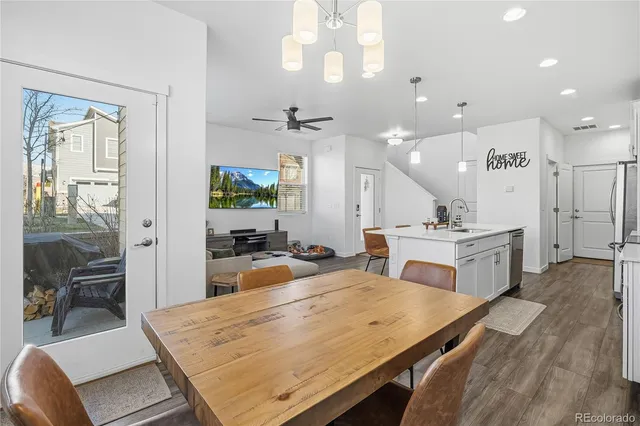 a view of a dining room with furniture window and wooden floor