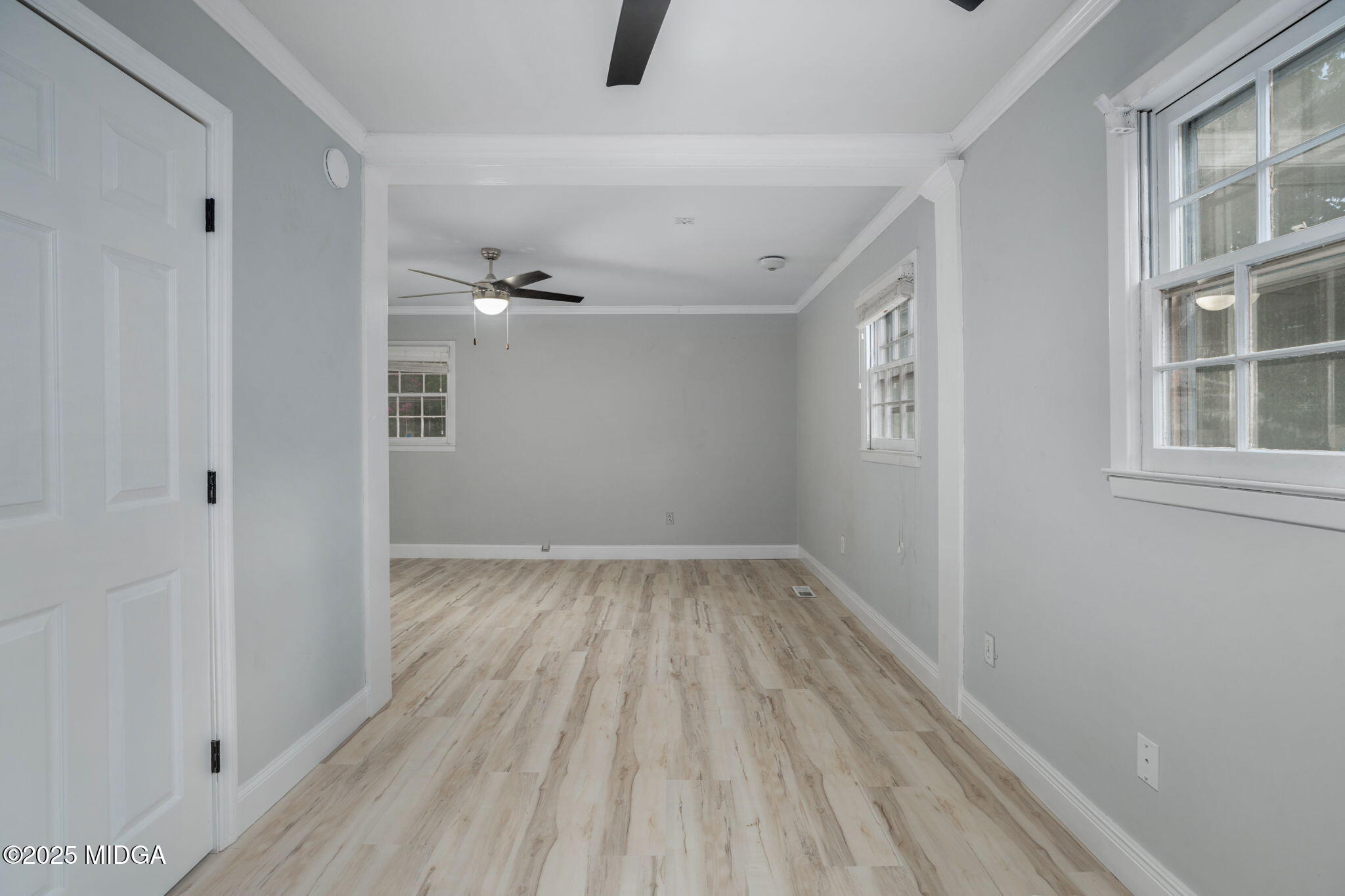 113 Colonial Road Warner Robins, GA 31088 - Photo 19 of 34 wooden floor in an empty room with a window