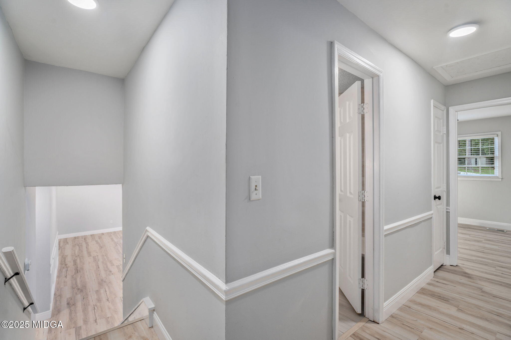 113 Colonial Road Warner Robins, GA 31088 - Photo 20 of 34 a view of a hallway with closet and wooden floor