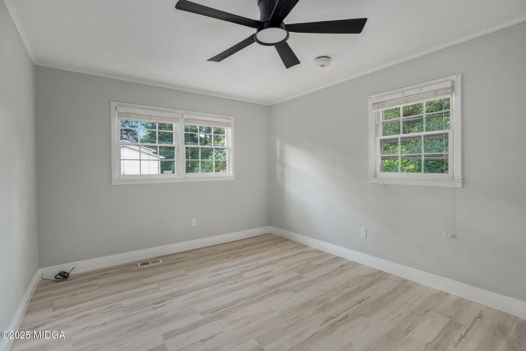 113 Colonial Road Warner Robins, GA 31088 - Photo 27 of 34 a view of empty room with wooden floor and fan