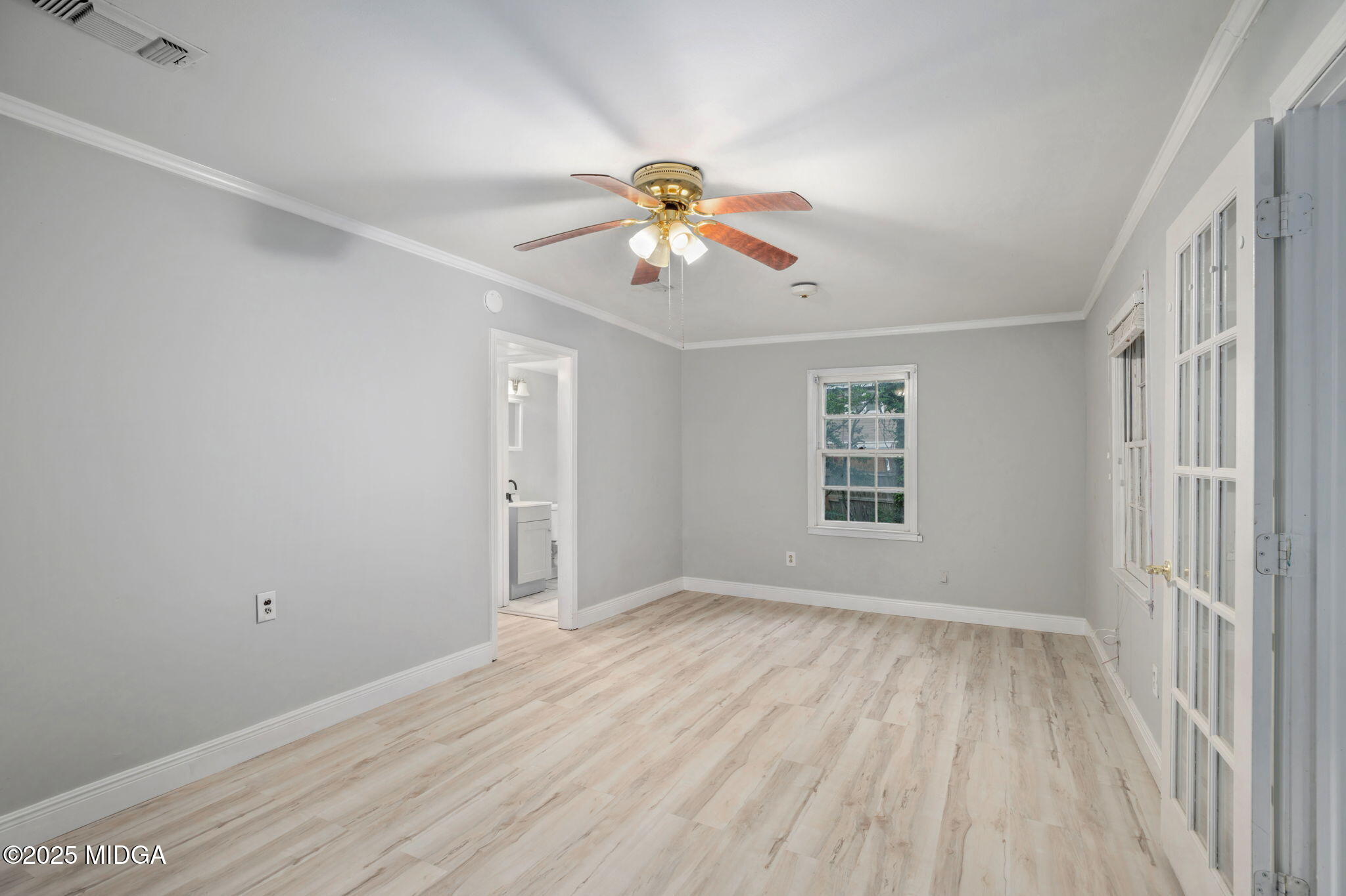 113 Colonial Road Warner Robins, GA 31088 - Photo 31 of 34 a view of room with ceiling fan and window