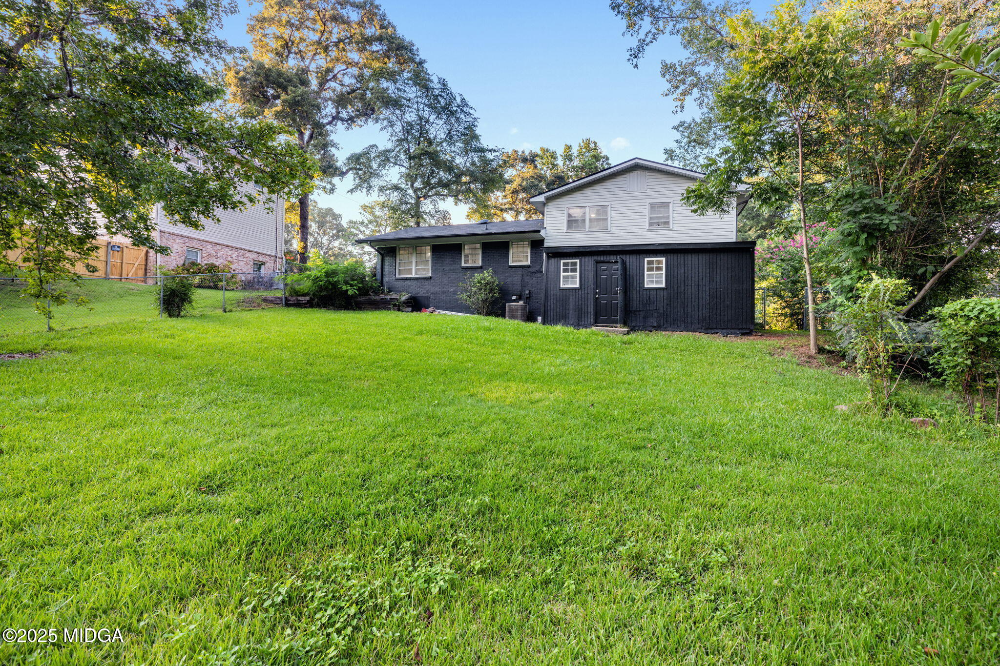 113 Colonial Road Warner Robins, GA 31088 - Photo 34 of 34 a view of a big yard in front of a house with large trees