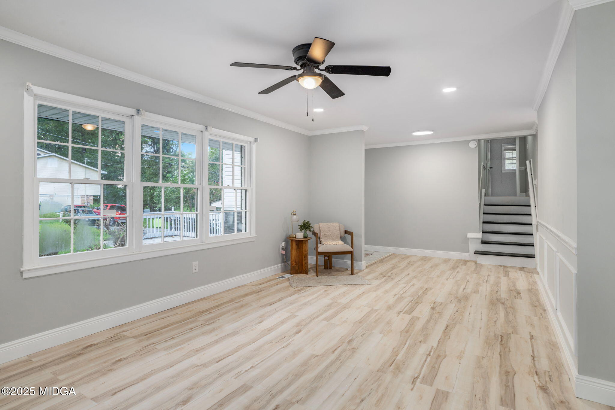 113 Colonial Road Warner Robins, GA 31088 - Photo 7 of 34 a view of empty room with wooden floor and fan