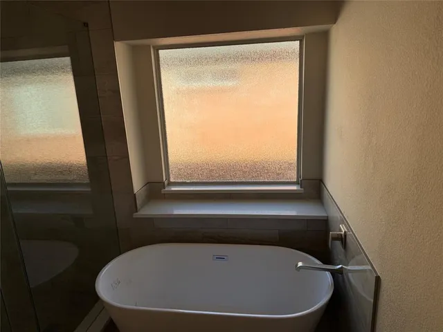 a bathroom with a bathtub