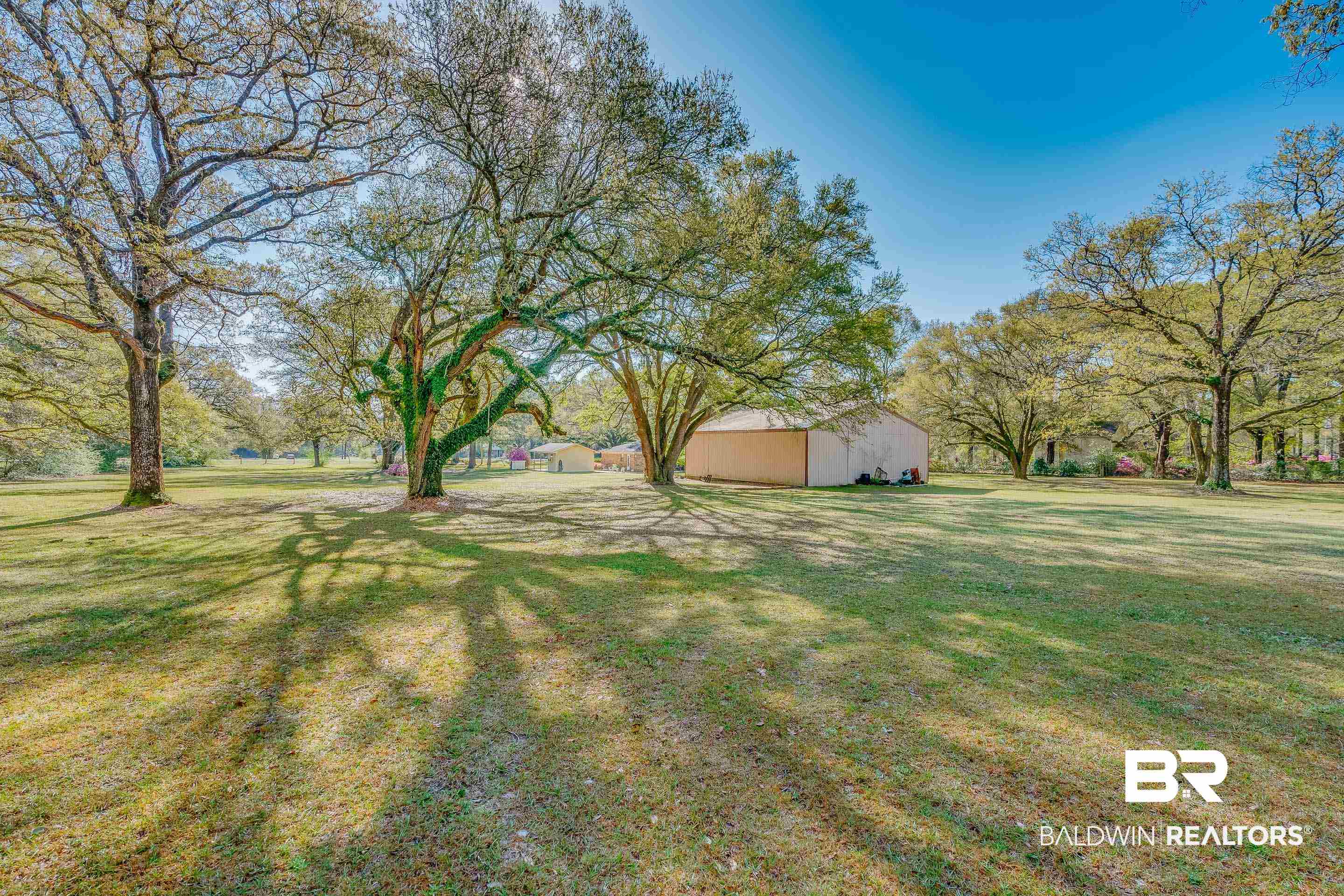 5151 McCrary Road Semmes, AL 36575 - Photo 28 of 62 View of grassy yard with an outbuilding and an outdoor structure