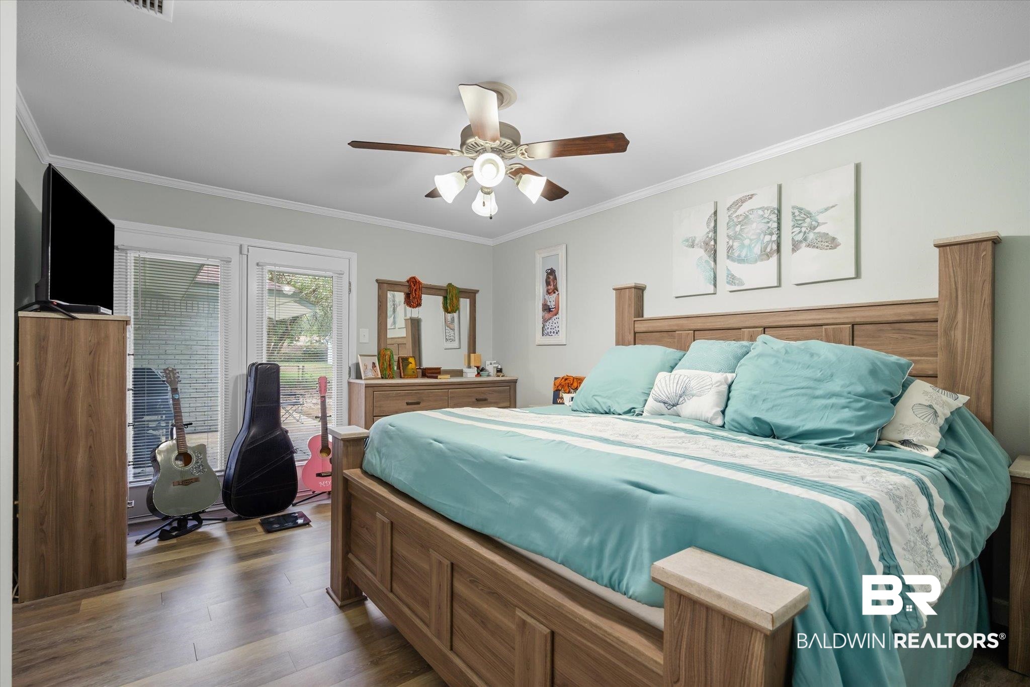 9987 Downing Street Semmes, AL 36575 - Photo 10 of 20 Bedroom with ceiling fan, crown molding, and dark hardwood / wood-style flooring