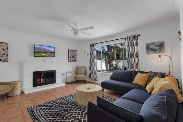 a living room with furniture and a rug