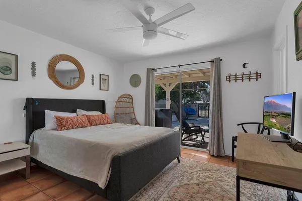 a bedroom with a bed and a desk