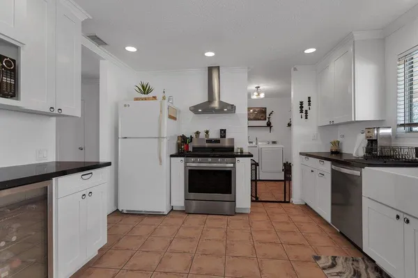 a utility room with closet dryer and washer