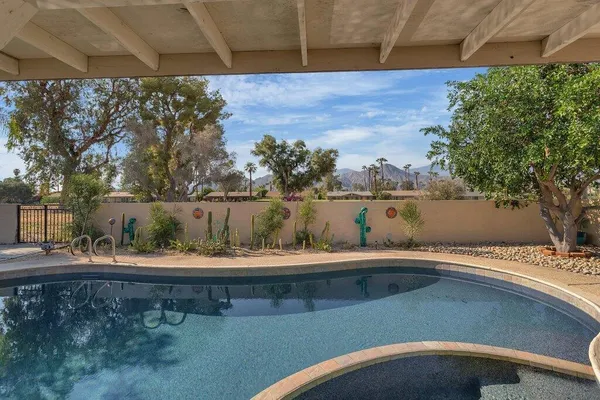 a view of swimming pool with a yard