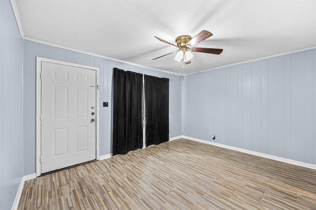 709 Sissom Road Killeen, TX 76541 - Photo 5 of 24 a view of a big room with wooden floor and closet in a room