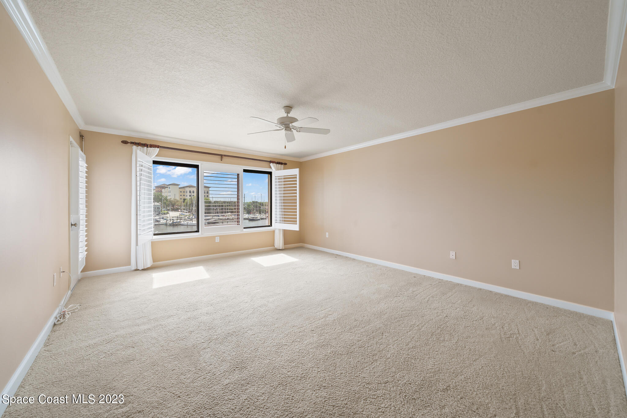 2220 Front Street, Unit 303 Melbourne, FL 32901 - Photo 16 of 24 a view of an empty room with a window