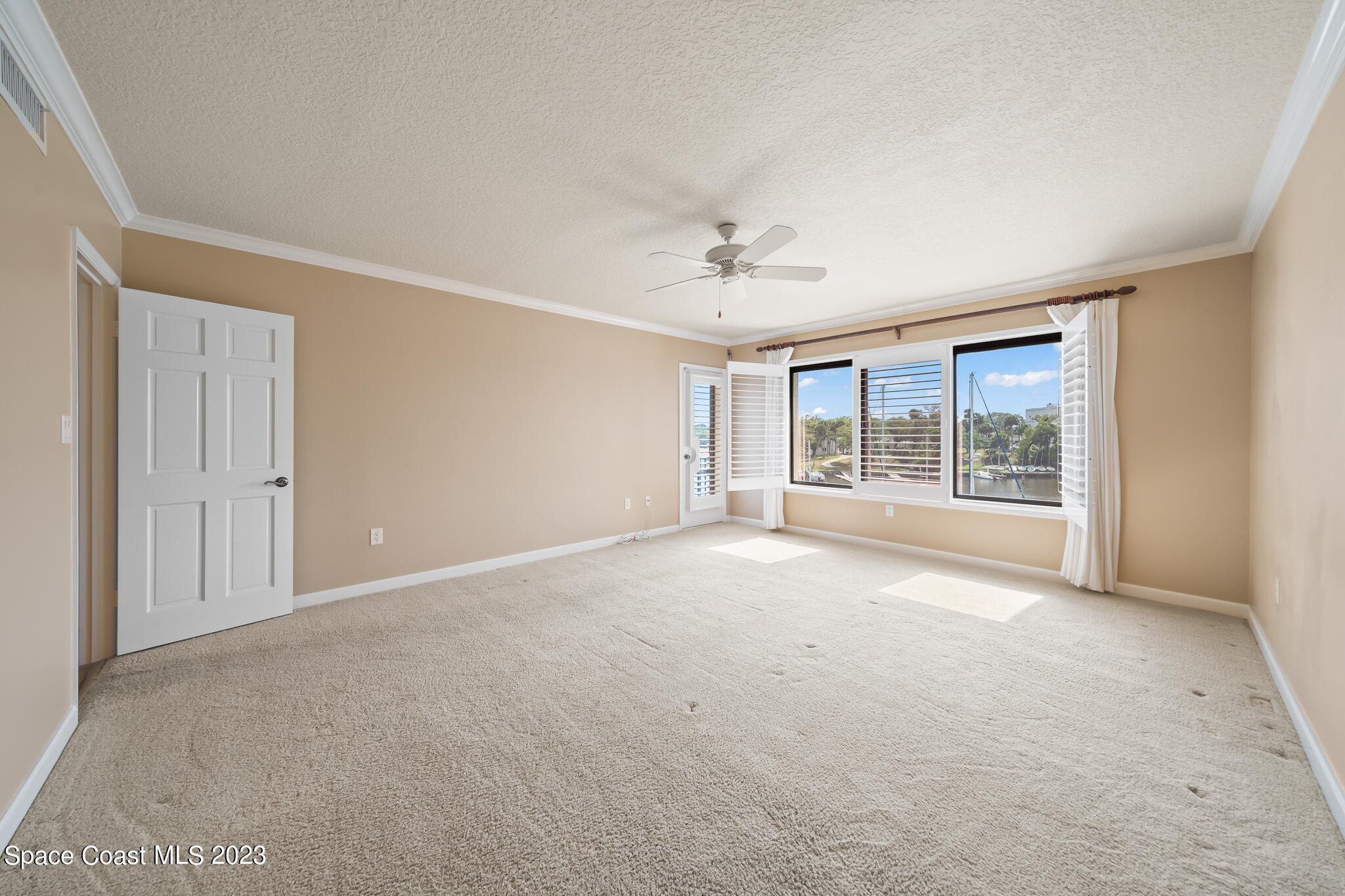 2220 Front Street, Unit 303 Melbourne, FL 32901 - Photo 17 of 24 a view of an empty room with a window