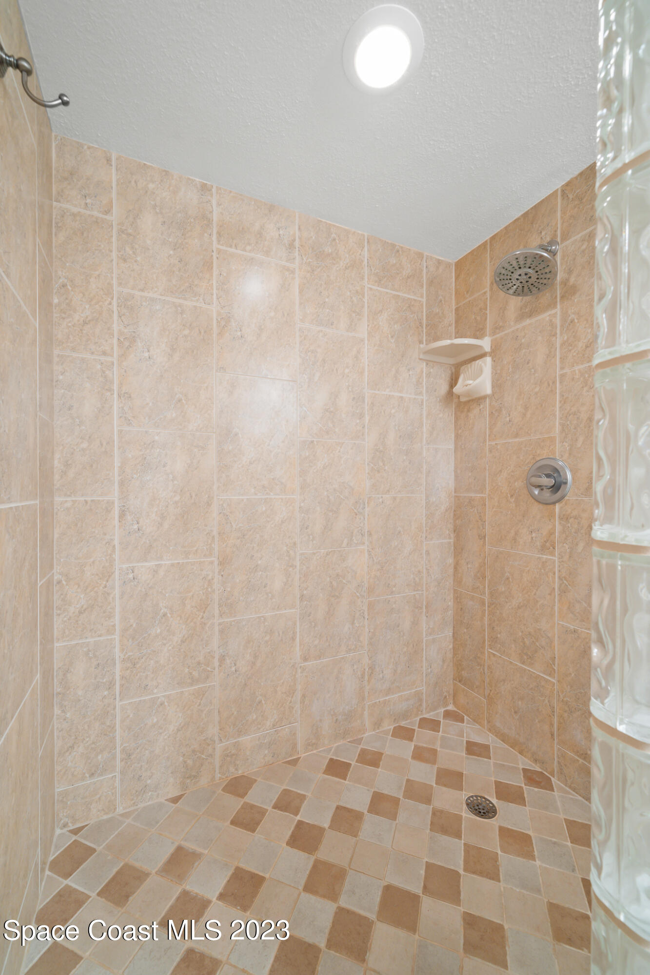 2220 Front Street, Unit 303 Melbourne, FL 32901 - Photo 18 of 24 a bathroom with a shower