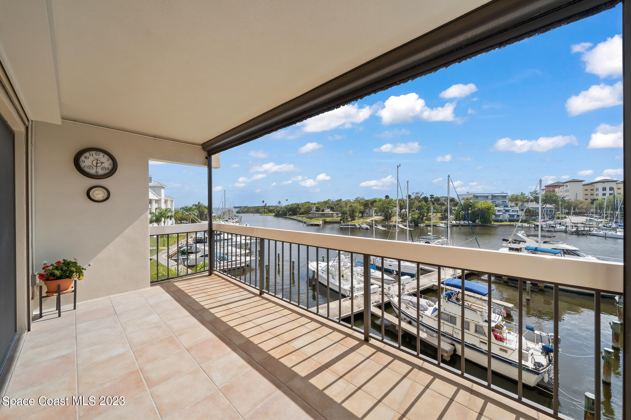 2220 Front Street, Unit 303 Melbourne, FL 32901 - Photo 21 of 24 a balcony with hardwood