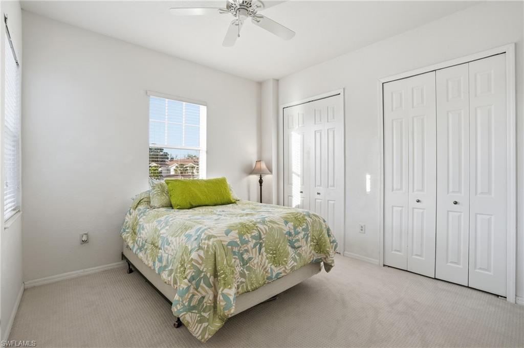 970 Peggy Circle, Unit 604 Naples, FL 34113 - Photo 11 of 24 Carpeted bedroom with multiple closets and ceiling fan