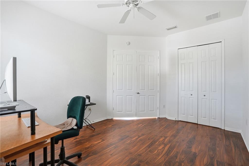 970 Peggy Circle, Unit 604 Naples, FL 34113 - Photo 12 of 24 Home office featuring dark wood finished floors and ceiling fan