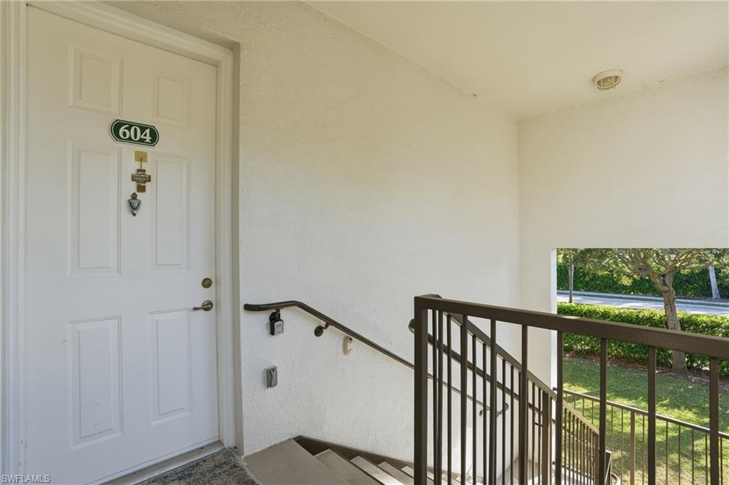 970 Peggy Circle, Unit 604 Naples, FL 34113 - Photo 2 of 24 Doorway to property featuring stucco siding