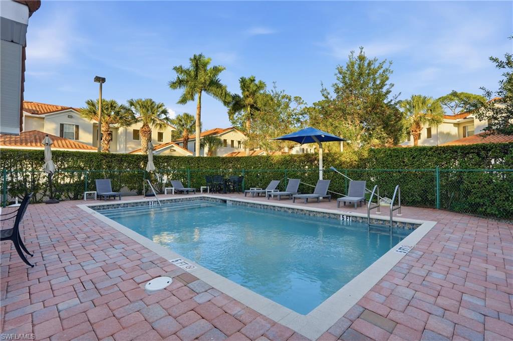 970 Peggy Circle, Unit 604 Naples, FL 34113 - Photo 24 of 24 Community pool with a patio area