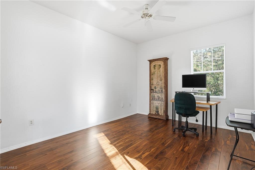 970 Peggy Circle, Unit 604 Naples, FL 34113 - Photo 9 of 24 Home office with dark wood finished floors and a ceiling fan